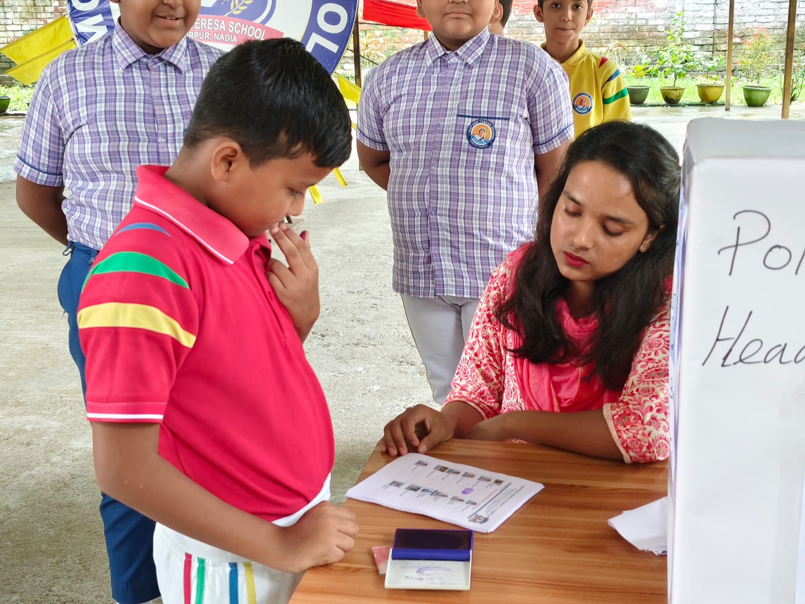 Student Checking Name on Voters List